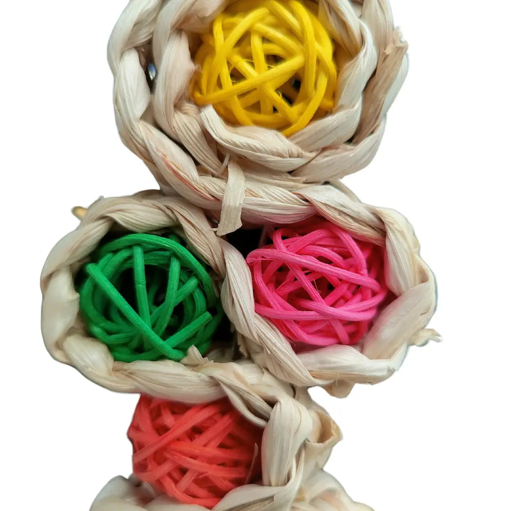 close up of the cane ball twister bird toy