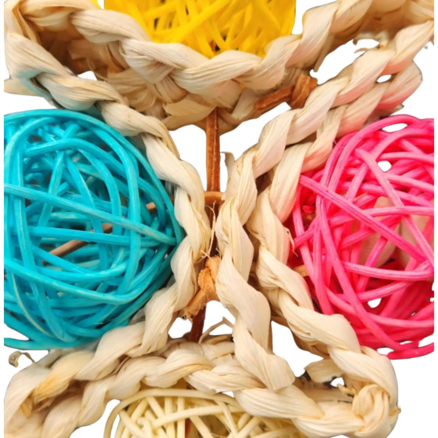 close up of four cane balls bird toy