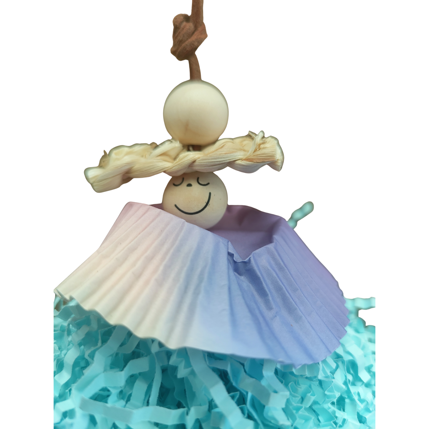 close up of the face of the little shaggy girl bird toy