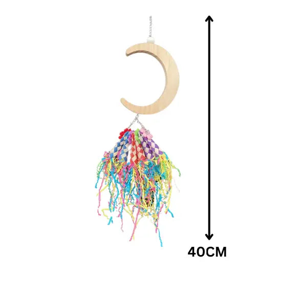 Measurements - Moon Party Shredable Bird Toy
This playful toy features a wooden moon with finger traps filled with crinkle paper. Perfect for smaller birds to perch, swing, and enjoy hours of shredding fun.
Size: 34 cm x 12 cm
