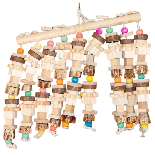 Measuring 35cm wide by 33cm high, this impressive toy is built around a solid natural wood base, featuring nine dangling strands overflowing with wood pieces, mahogany pods, and coloured wooden round beads.
Designed specifically for large birds who love to chew, shred, and explore, this toy offers a rich variety of textures and shapes to promote mental stimulation, physical exercise, and natural foraging behaviours.