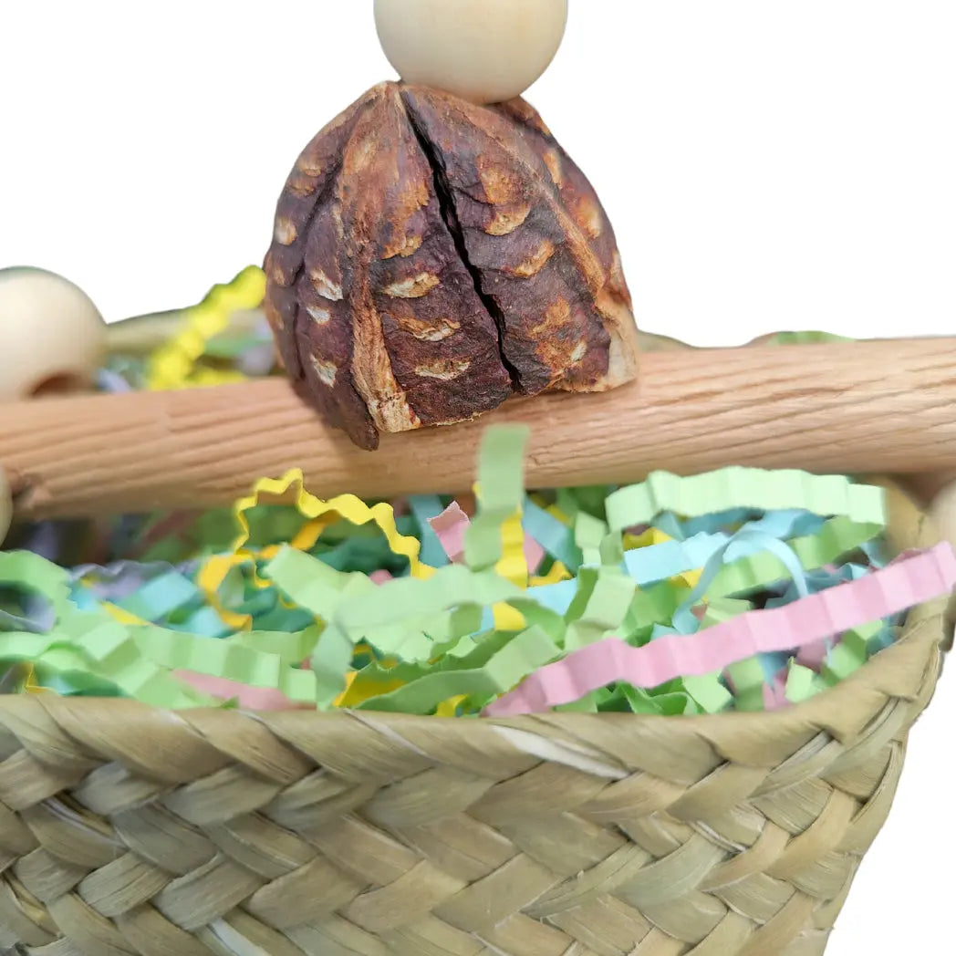 close up of the top of the basket bird toy