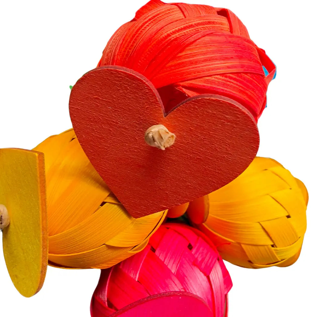 close up paper balls and hearts bird toy