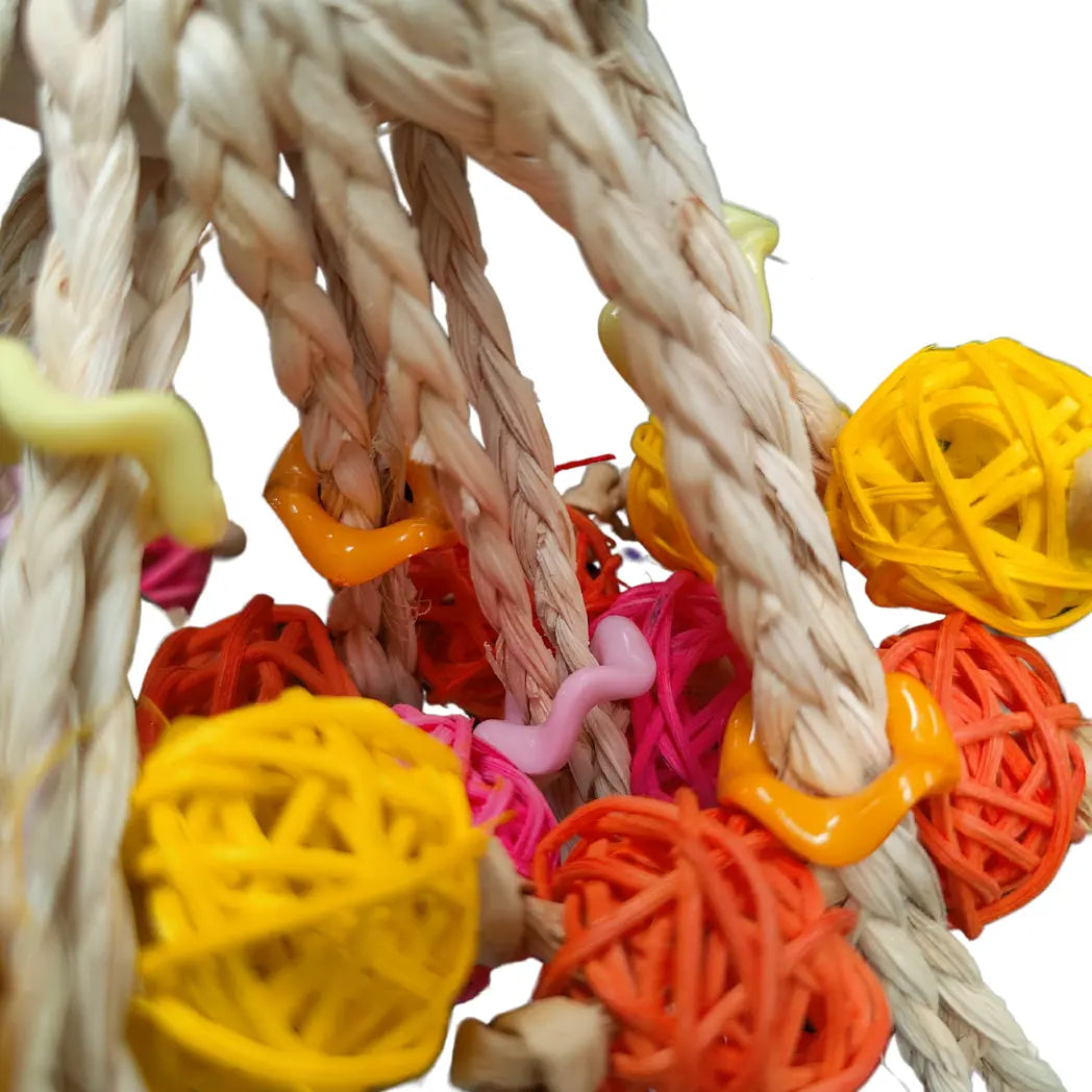 close up of ring with cane balls bird toy
