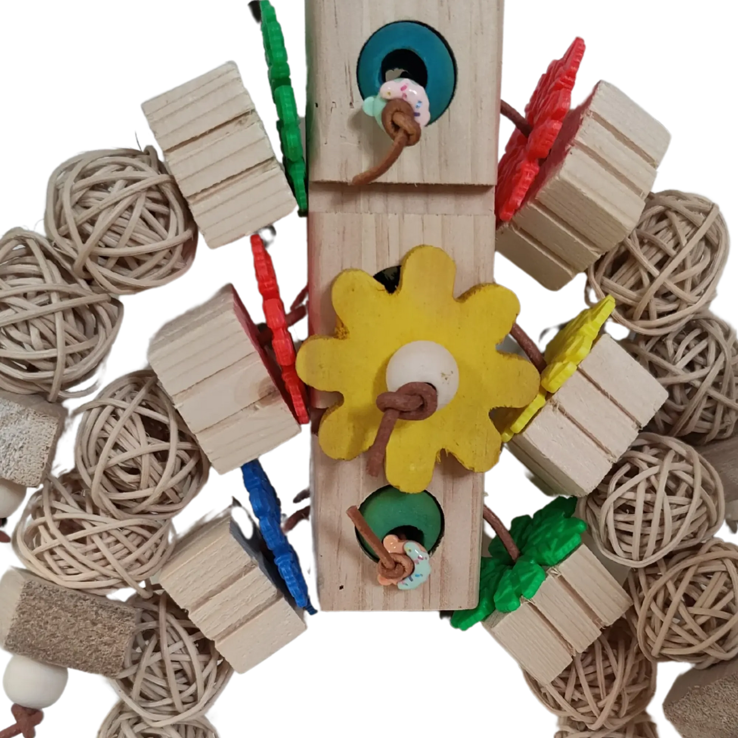 Closeup Wood blocks and cane balls aligned together to look like a robot. Connected with leather cord and hung by the center blocks by a quick link. Shop Now.