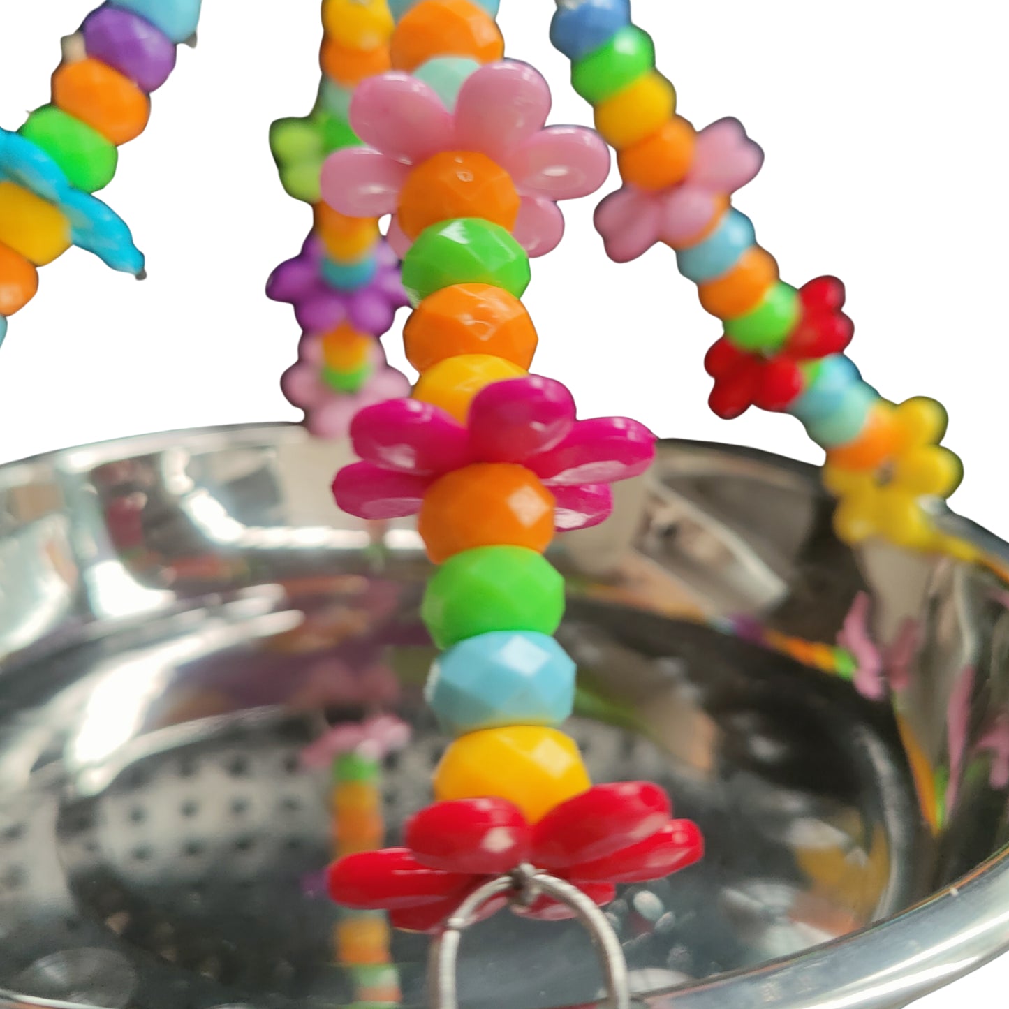close up of the stainless steel hanging bowl bird toy