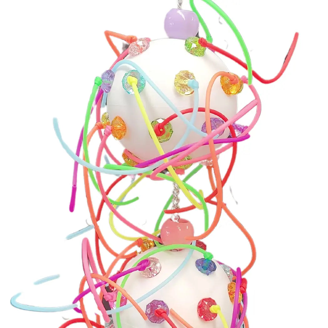 close up stringy balls bird toys