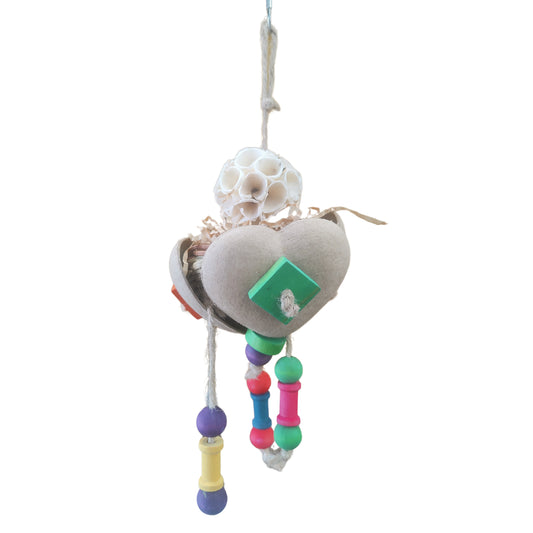 shredable bird toy encased with 3 natural hearts