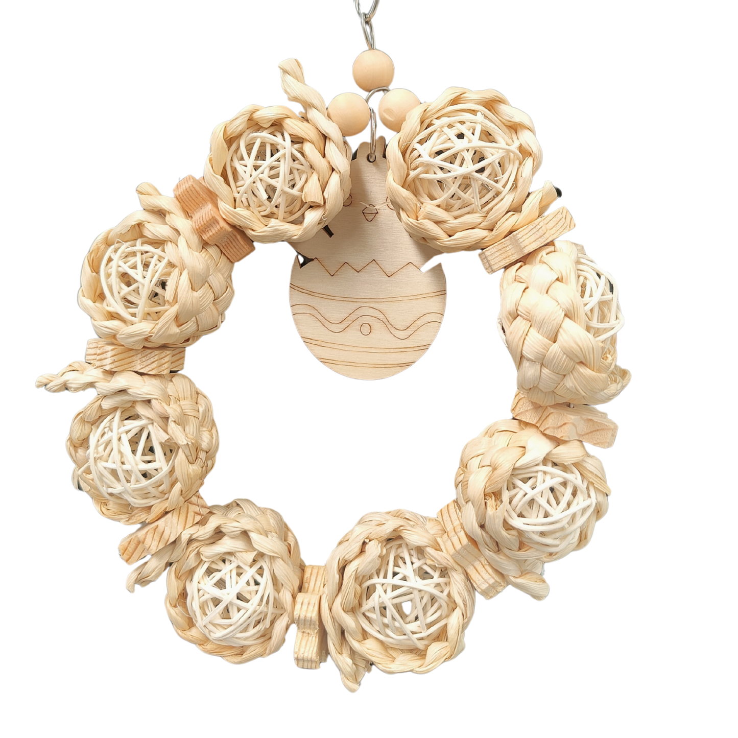 cane balls and wood pieces in a ring with a wood chick bird toy