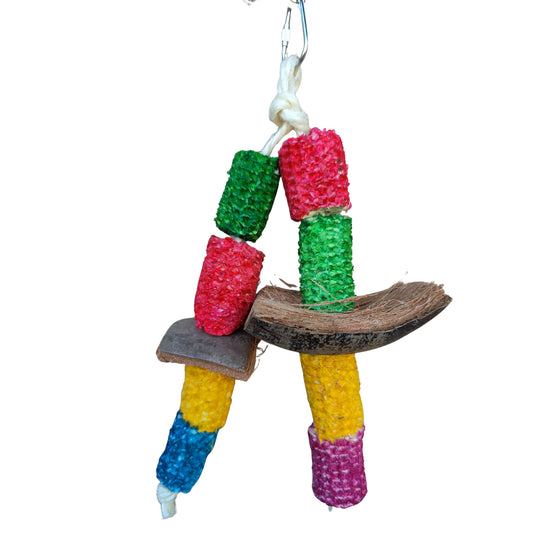 bird toy with coloured corn husks with coconut pieces