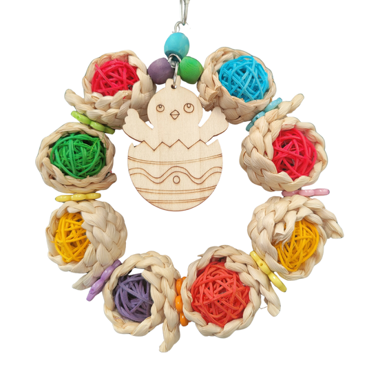 ring of coloured cane balls with a wooden chick in the center bird toy