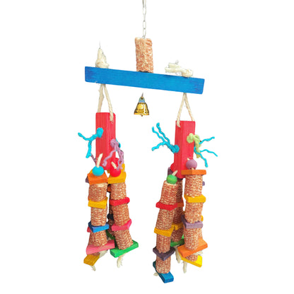 this bird toy has dried corn cobs dangling from red wood blocks