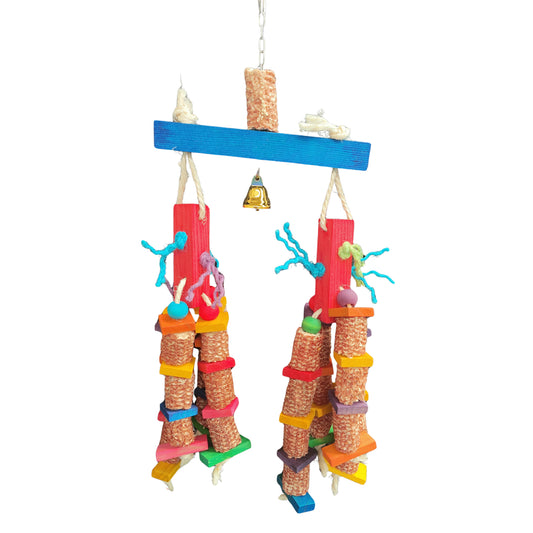 this bird toy has dried corn cobs dangling from red wood blocks