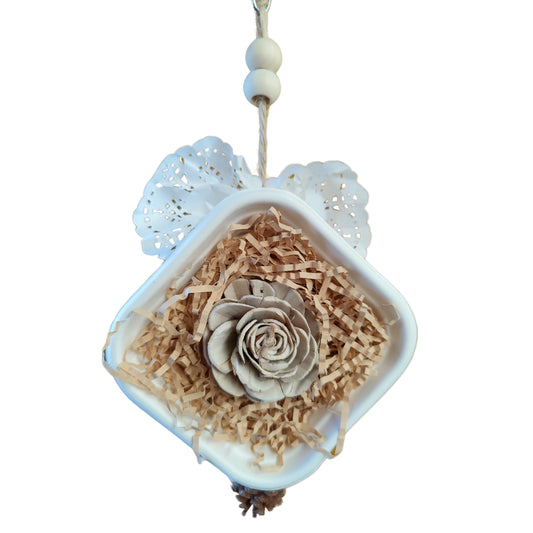 Diamond shape bird toy with wood rose in center 