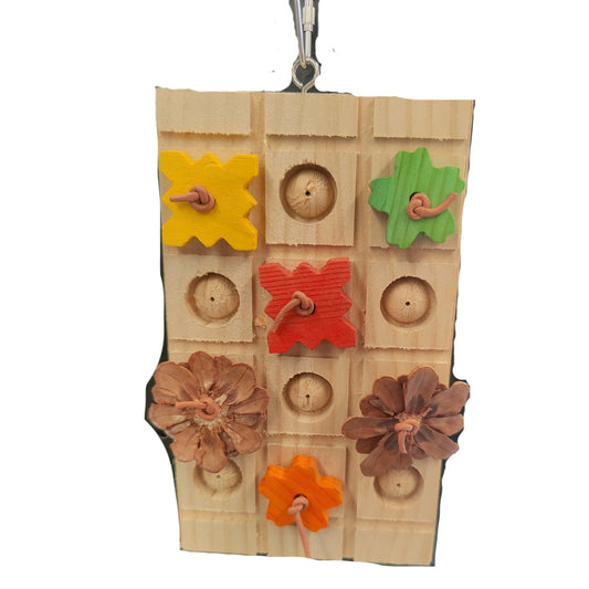 block of wood with wood flowers on it bird toy
