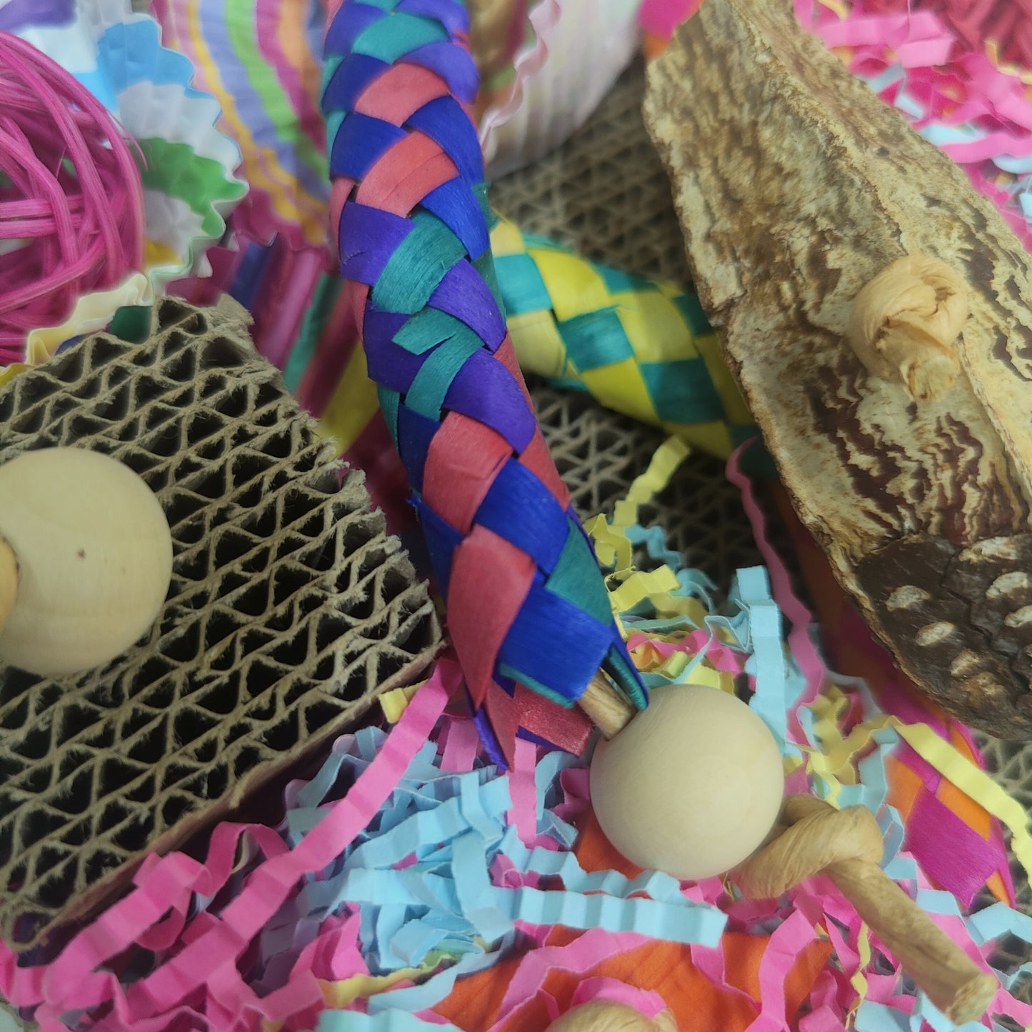 close up of the fun cardboard shred bird toy