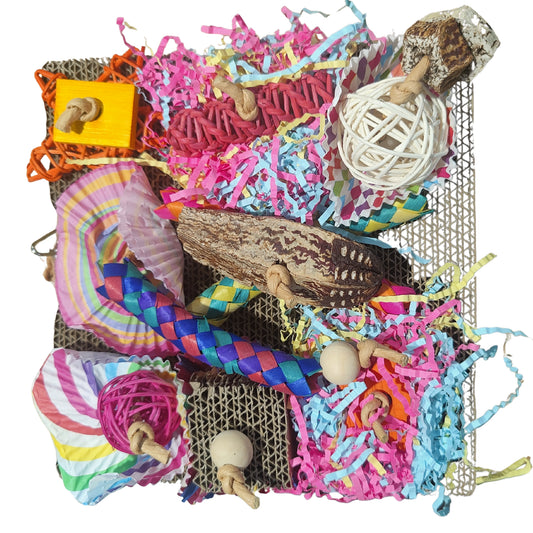 cardboard square with lots of fun pieces to shred bird toy