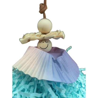 close up of the face of the little shaggy girl bird toy