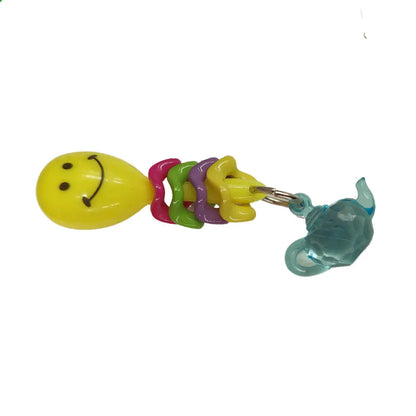 maraca wiggle rings and a tea pot make this cute bird foot toy