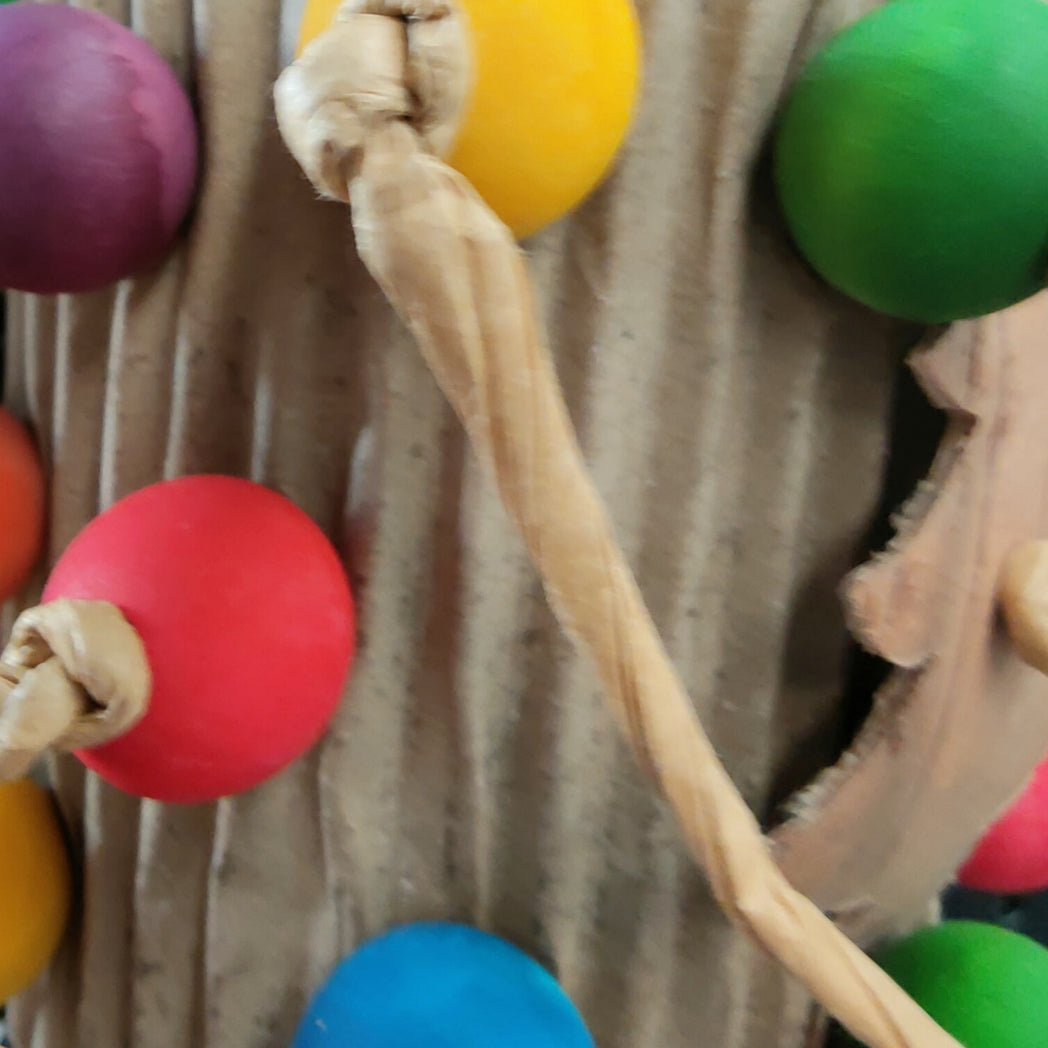 close up rolled cardboard with beads