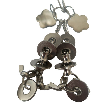 close up of the stainless steel flowers and rings bird toy