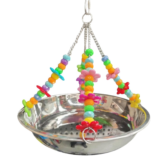 Colorful bird toy with beads and a stainless steel bowl on a white background