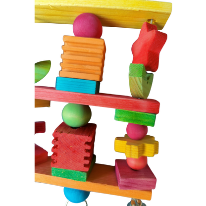 coloured wood star and leaves bird toy close up